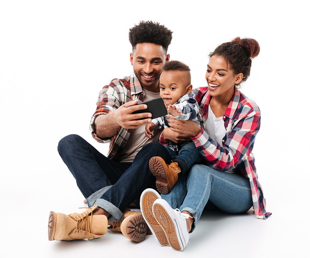 Mother and Father sitting with baby